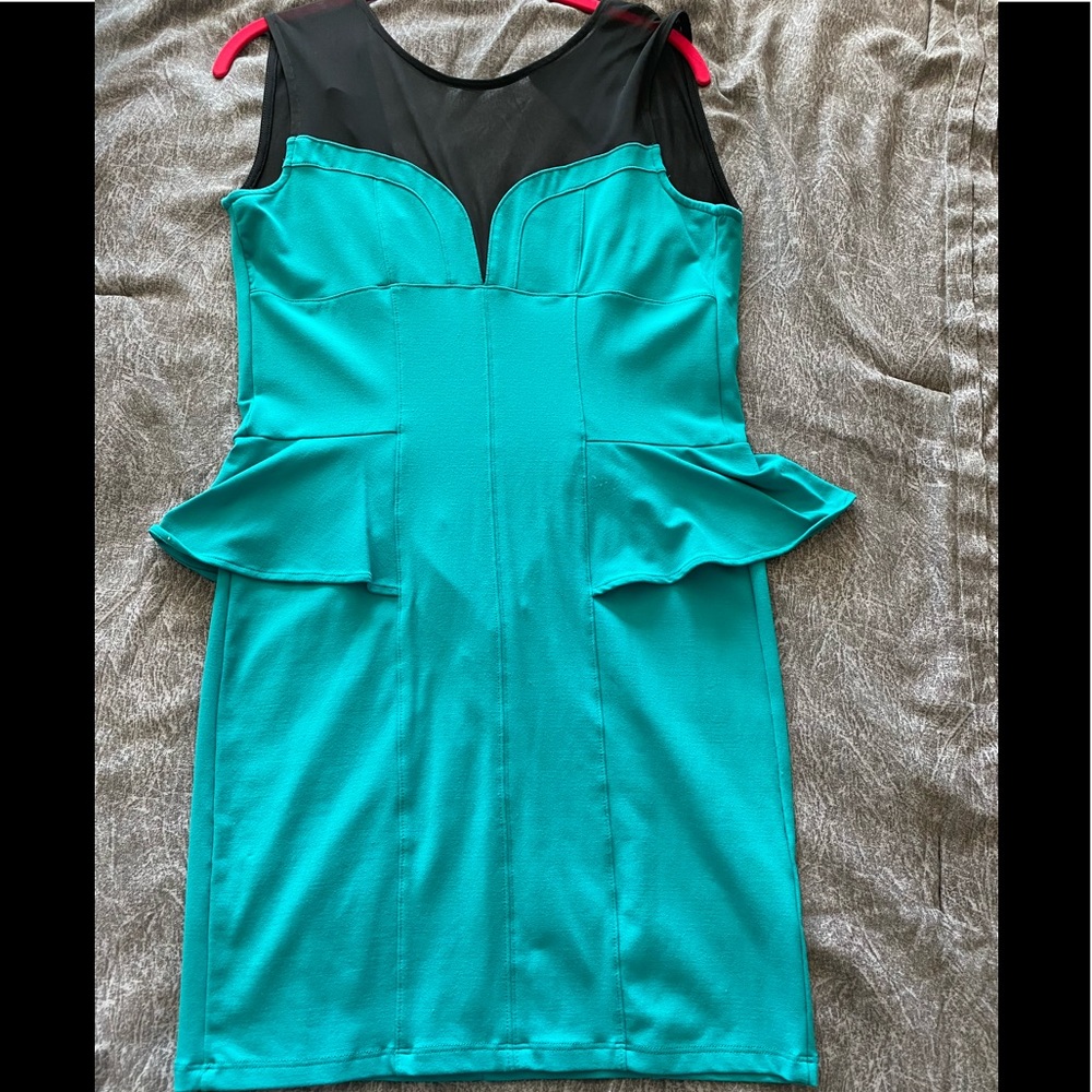 Peplum style dress with zipper up the back